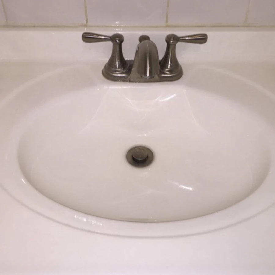 Bathroom sink before and after professional cleaning by Catherine's Cleaning