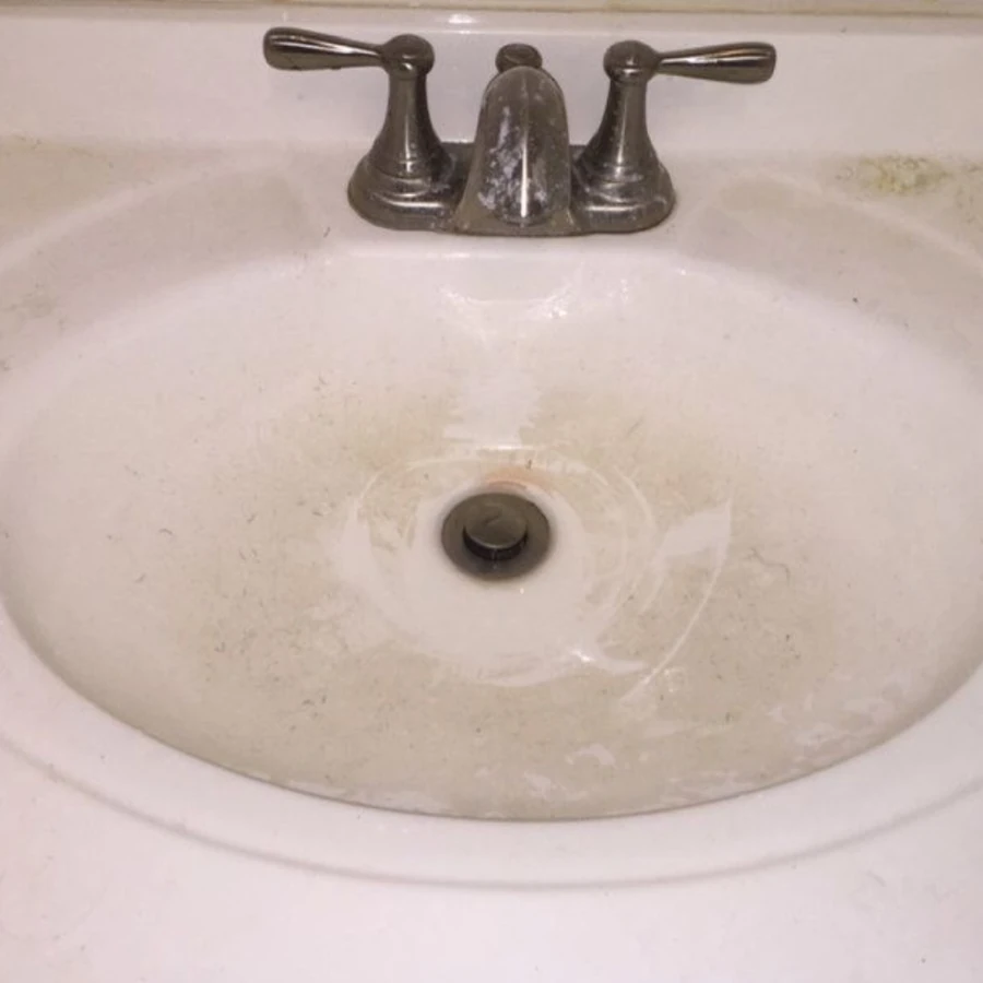 Bathroom sink before and after professional cleaning by Catherine's Cleaning